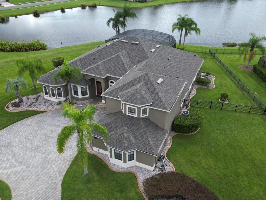 Image shows Florida home with CertainTeed architectural asphalt shingles. Color is "Weathered Wood".