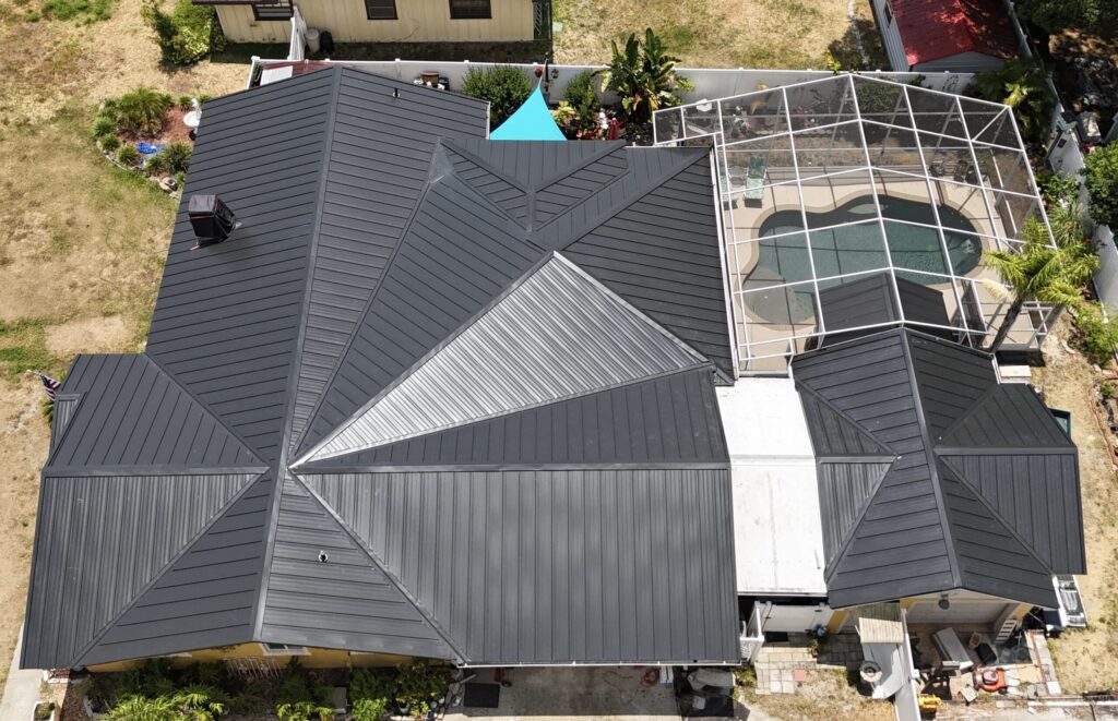 Image shows Florida home with a metal roof recently installed by Eave & Gable Roofing